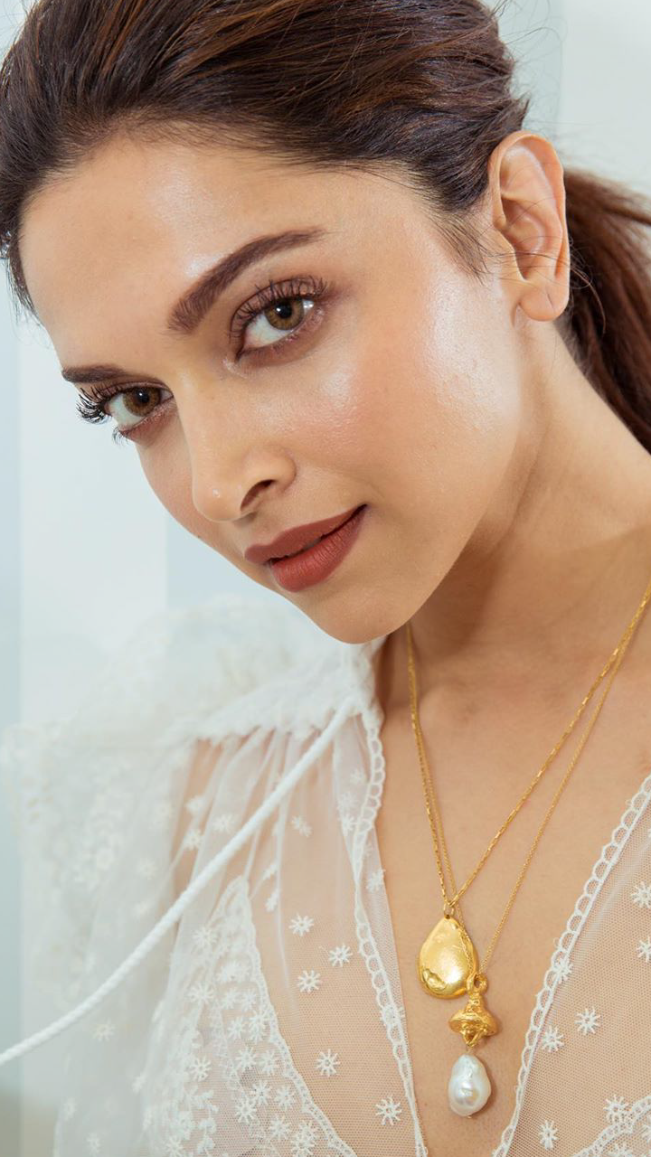 Gold and Diamond jewellery designs deepika padukone in uncut diamond and pearl  earrings