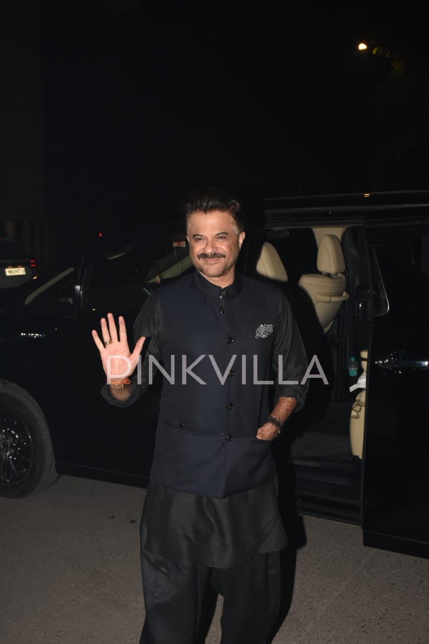 Anil Kapoor waves at the paps as he arrives at his mother Nirmal Kapoor's residence. 