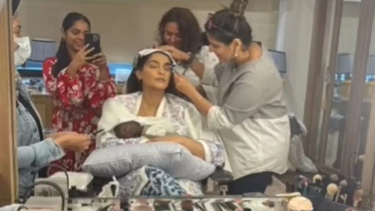 Video: Sonam Kapoor nurses baby Vayu while getting dolled up; Anand Ahuja has the cutest reaction