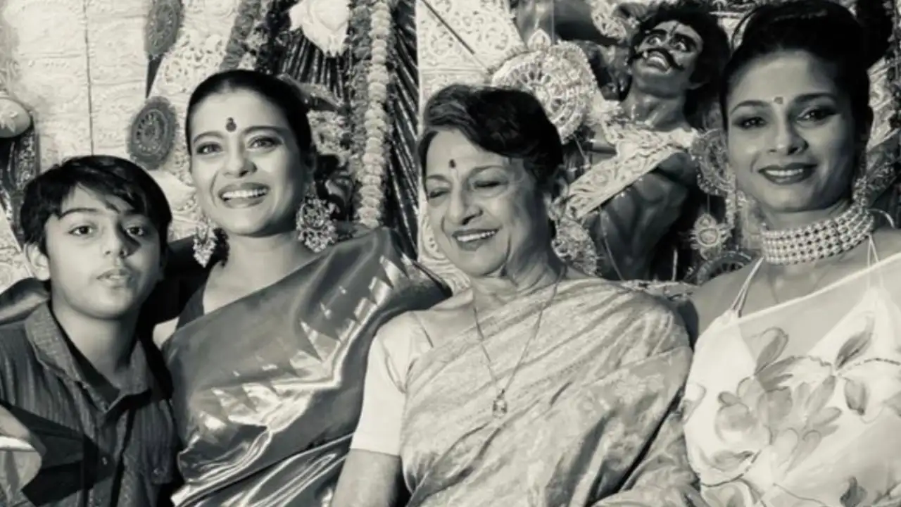 Kajol smiles as she poses with Tanuja, Tanishaa Mukerji and her son Yug from Durga Puja pandal; PIC Kajol smiles as she poses with Tanuja, Tanishaa Mukerji and her son Yug from Durga Puja pandal; PIC