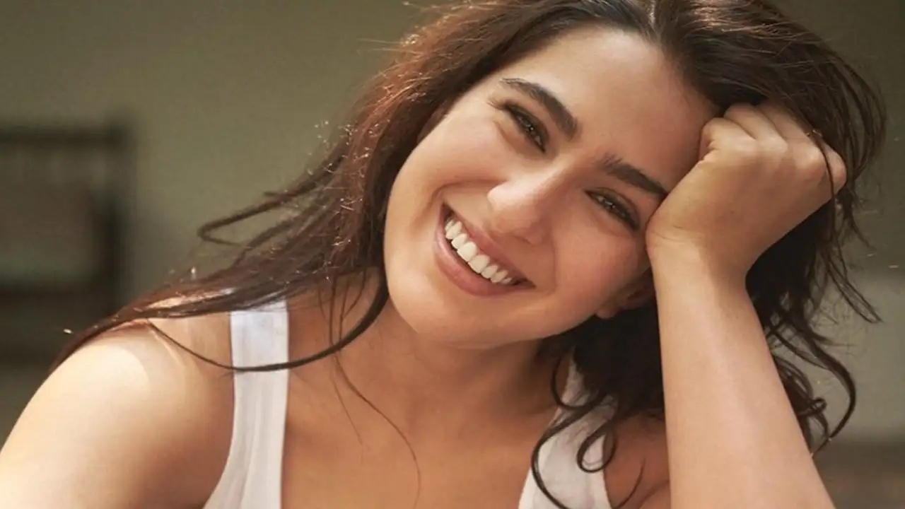 Sara Ali Khan can't stop smiling as she looks chic in white tank top and distressed jeans; PICS