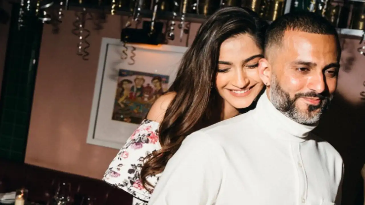 Sonam Kapoor and Anand Ahuja pose for the camera. 
