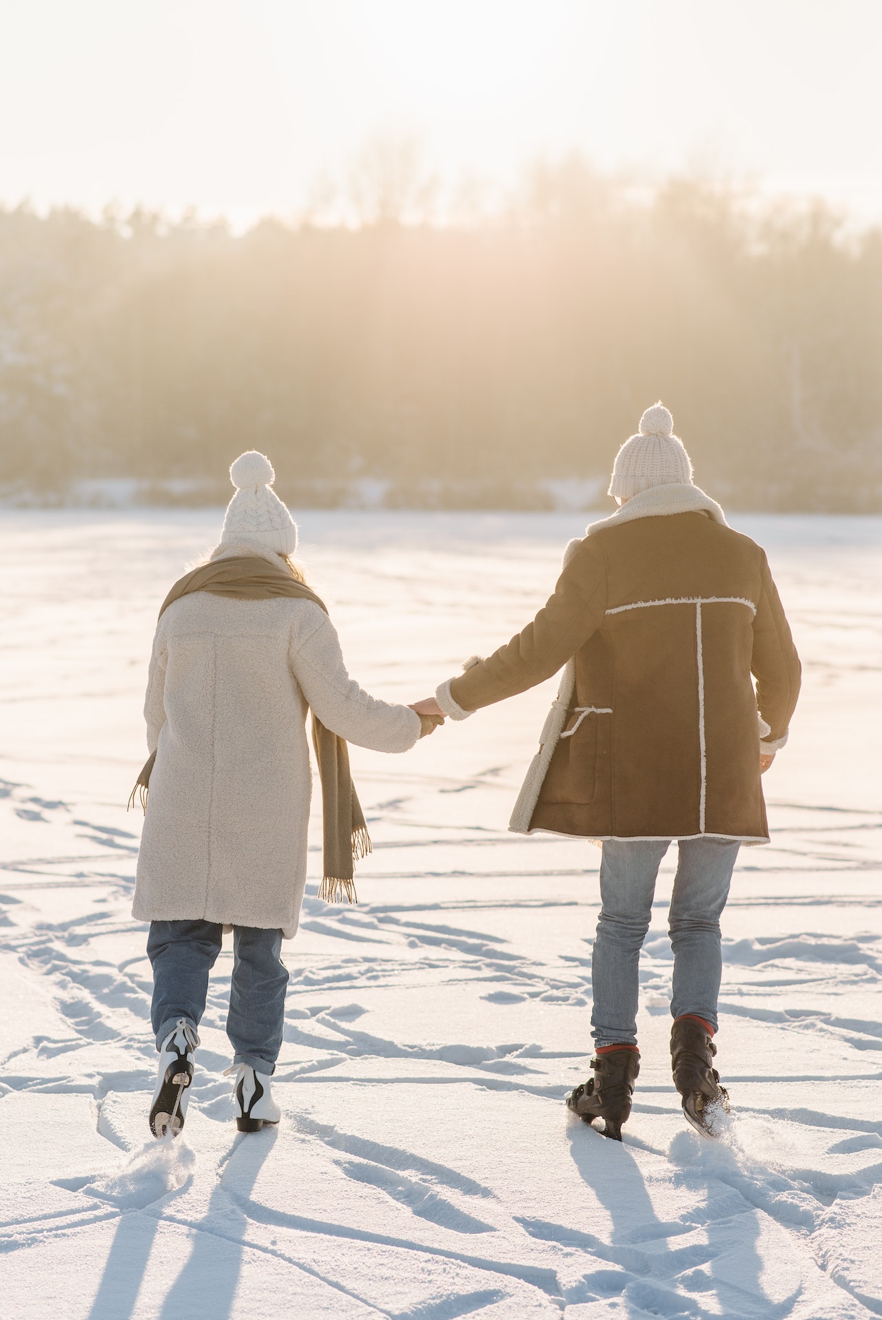 A teen couple ice-skating for a date
