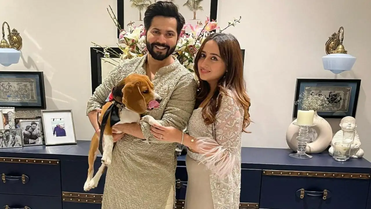 Picture courtesy: Varun Dhawan Instagram Varun Dhawan and Natasha Dalal pose with their furry friend