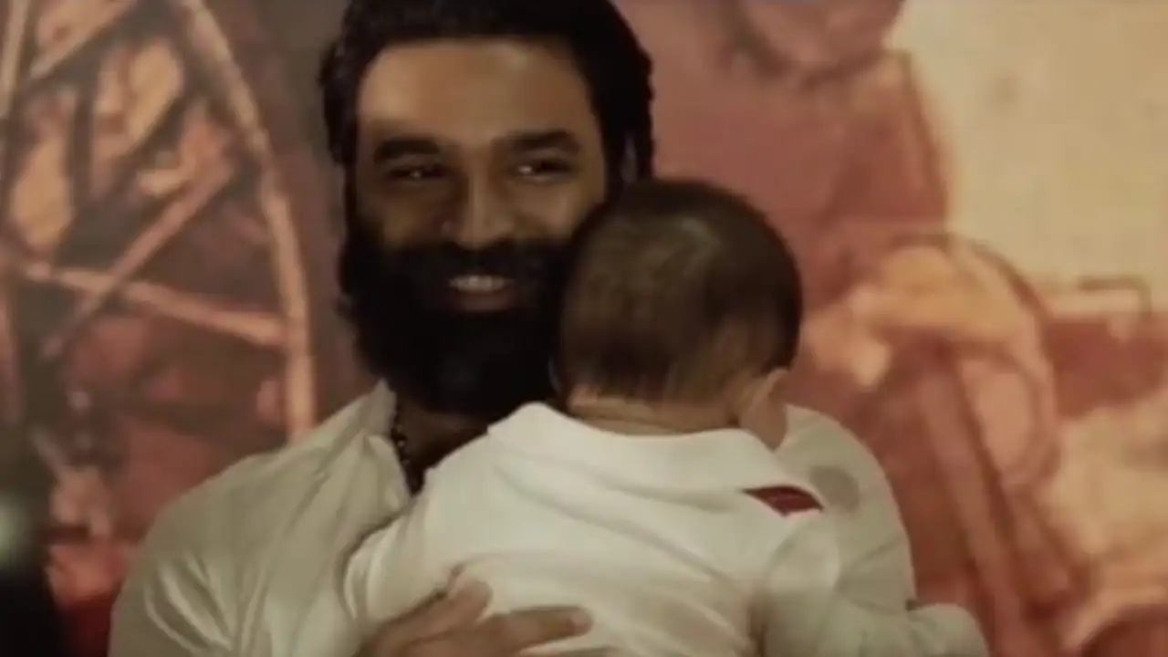 Dhanush playing with a toddler Photo Courtesy: (Instagram)