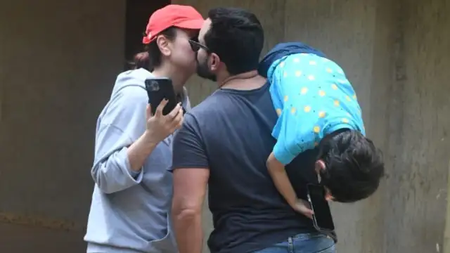 Kareena Kapoor and Saif Ali Khan share a cute kiss while Taimur hangs on  daddy's shoulder; PICS | PINKVILLA