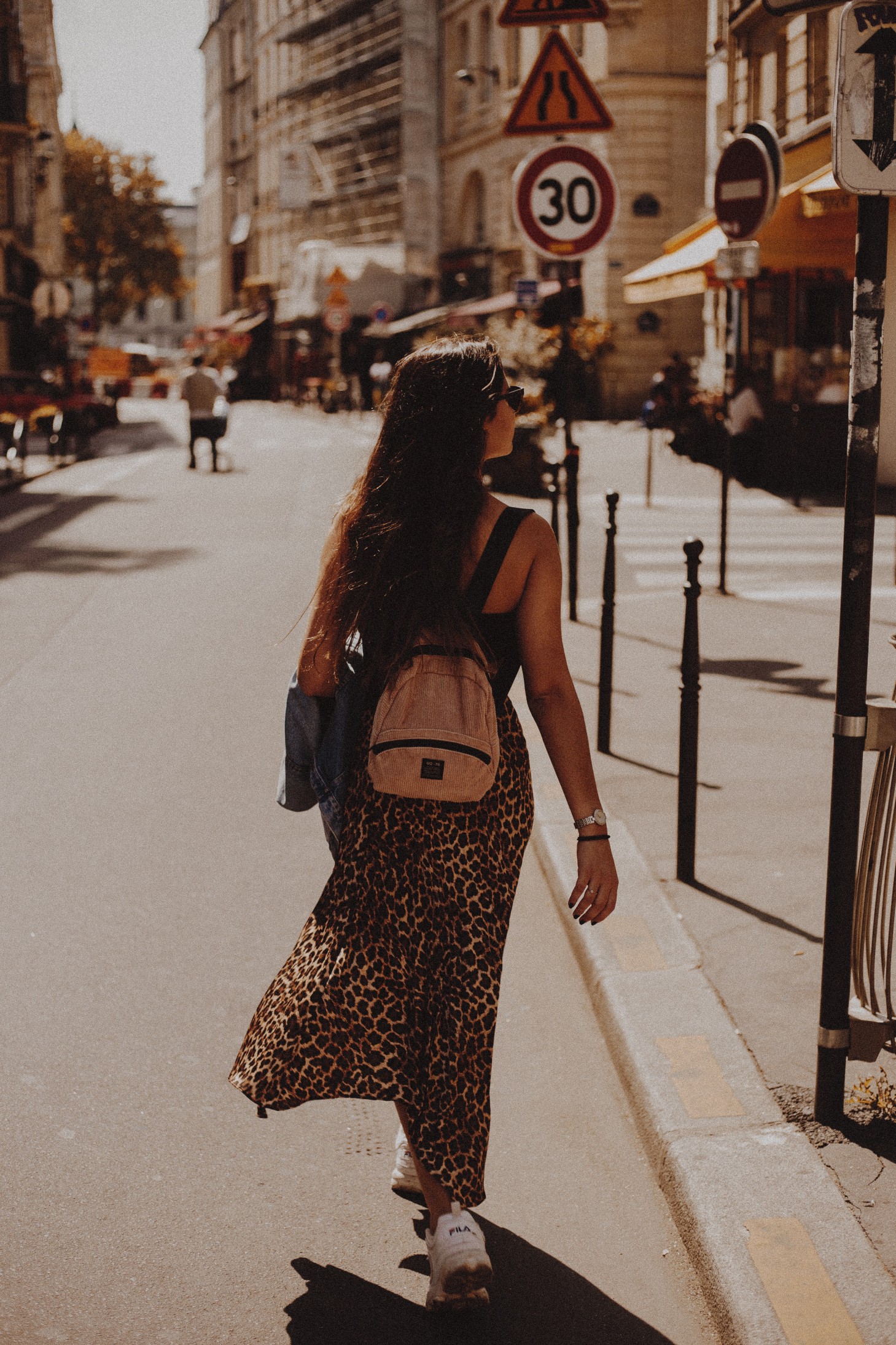 Woman with a backpack (Image Source: Pexels)