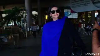 Sonam Kapoor amps up her style quotient in black and blue outfit as she walks out of airport