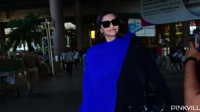 Sonam Kapoor amps up her style quotient in black and blue outfit as she walks out of airport