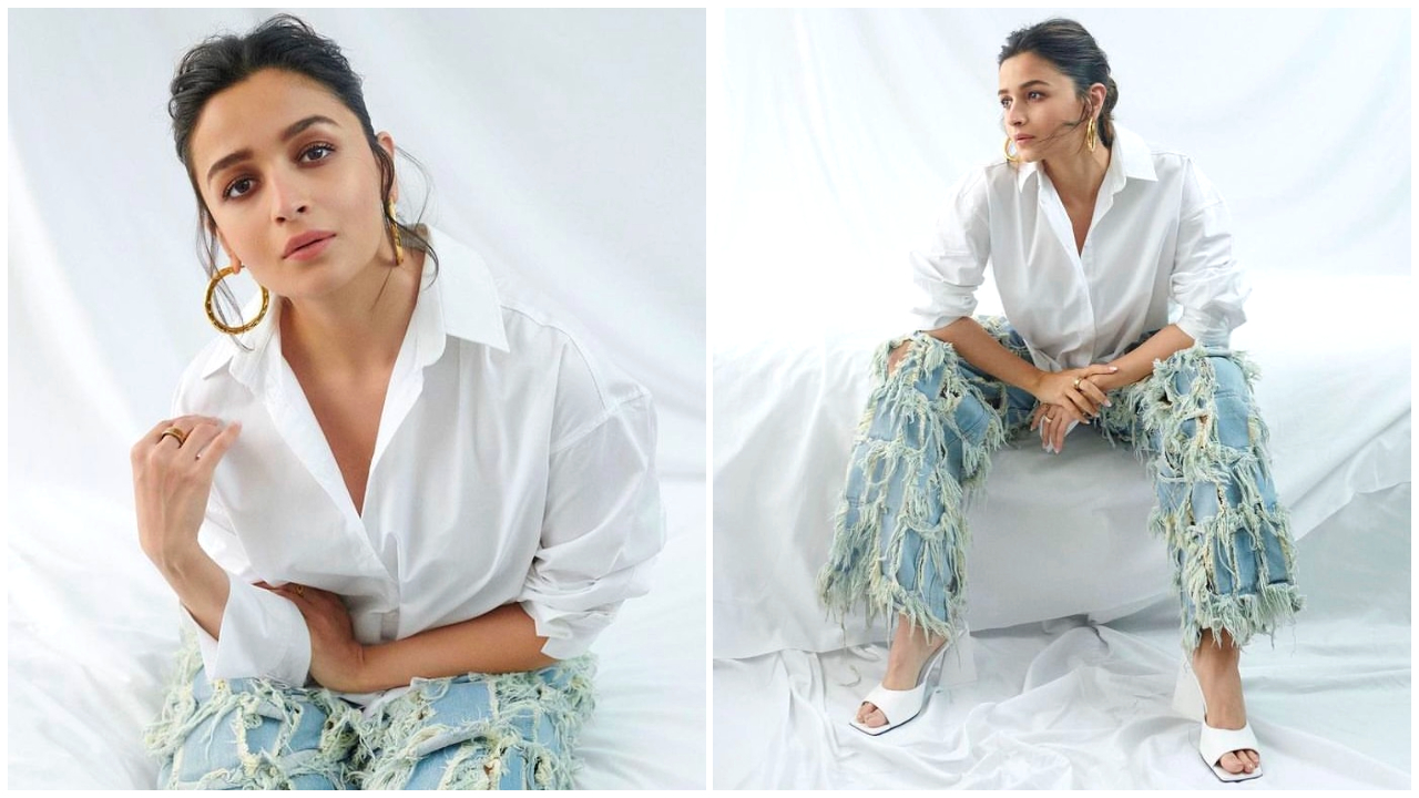 Alia in a white shirt and jeans