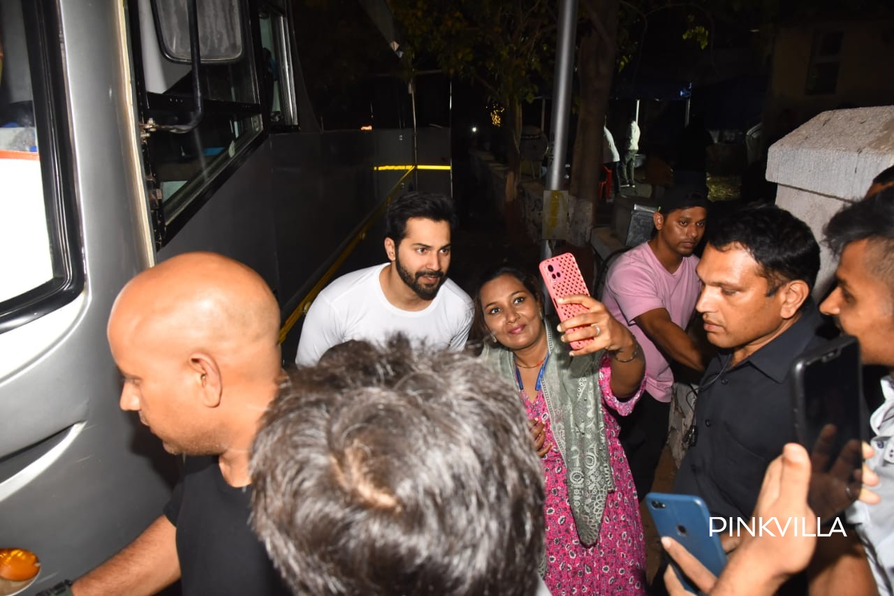 Varun Dhawan posing with fans