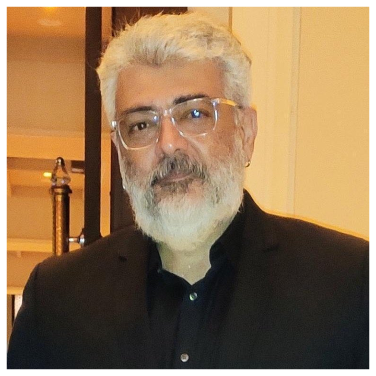 Ajith Kumar flaunts his ear piercing & natural white-haired look ...