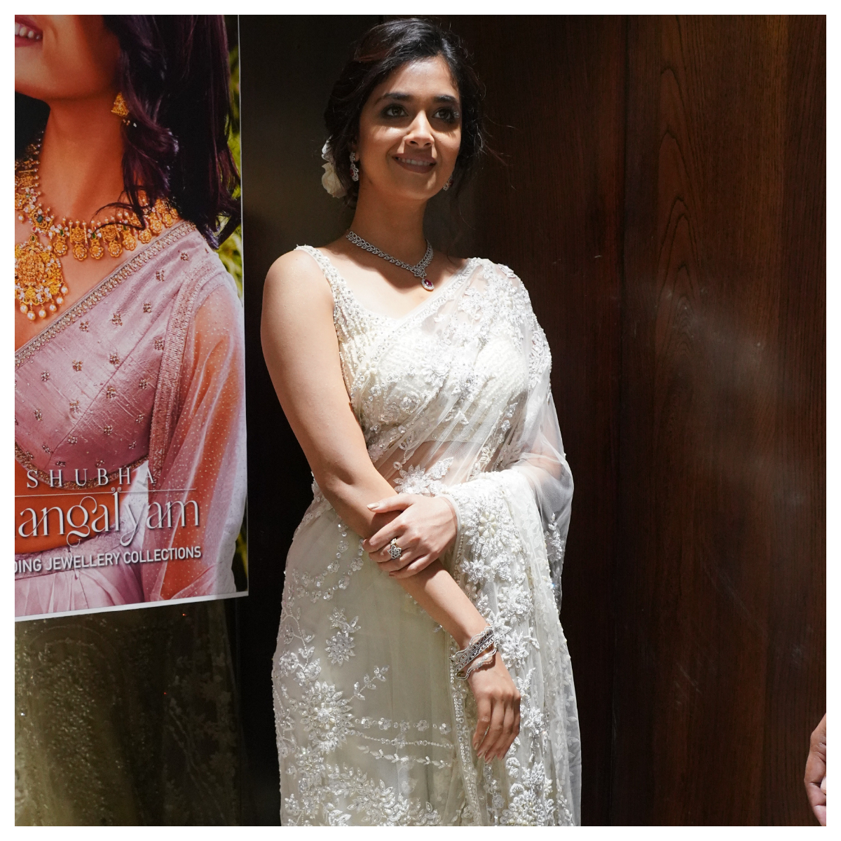 PICS: Keerthy Suresh looks resplendent in a white sheer organza saree as she waves at fans at an event