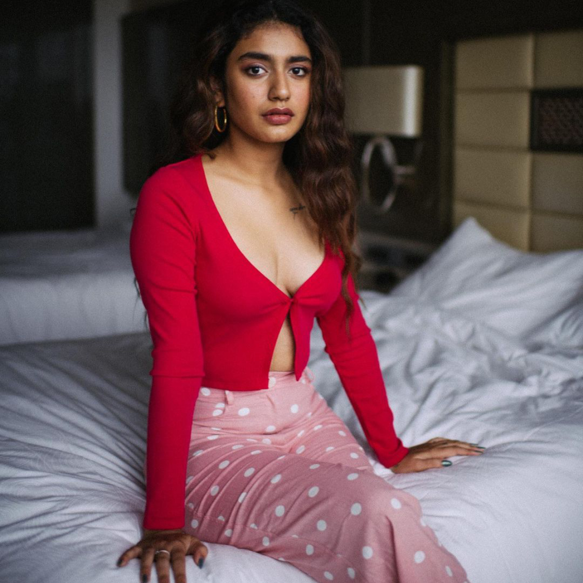 Priya Prakash Varrier looks alluring in a red top with a plunging neckline  in her latest PHOTOS | PINKVILLA