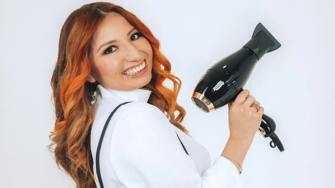 A woman with one of the Best Revlon Hair Dryers for Quick Salon-like Styling