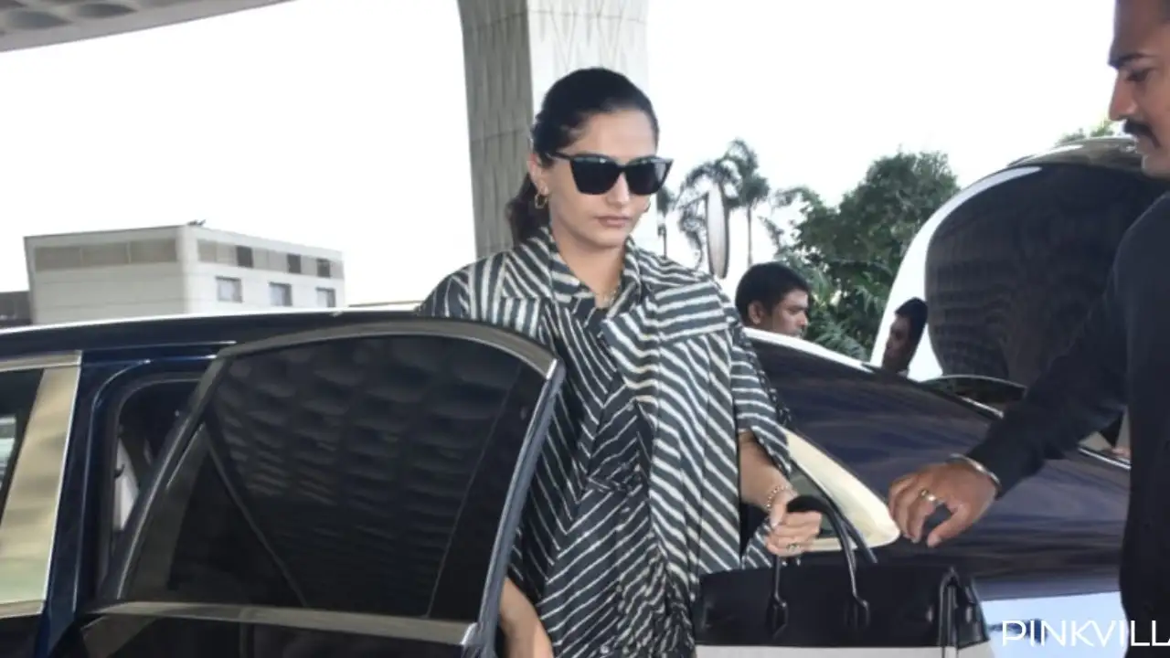 Sonam Kapoor makes heads turn in a black striped dress as she gets clicked  at the airport