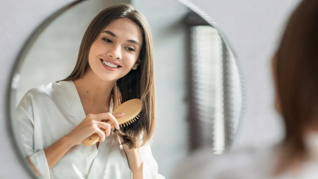 A woman using the Best Hair Brushes to Prevent Breakage