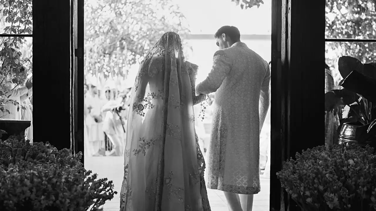 Athiya Shetty shares an UNSEEN pic from her wedding; Can you guess who is holding her hand? Athiya Shetty shares an UNSEEN pic from her wedding; Can you guess who is holding her hand?