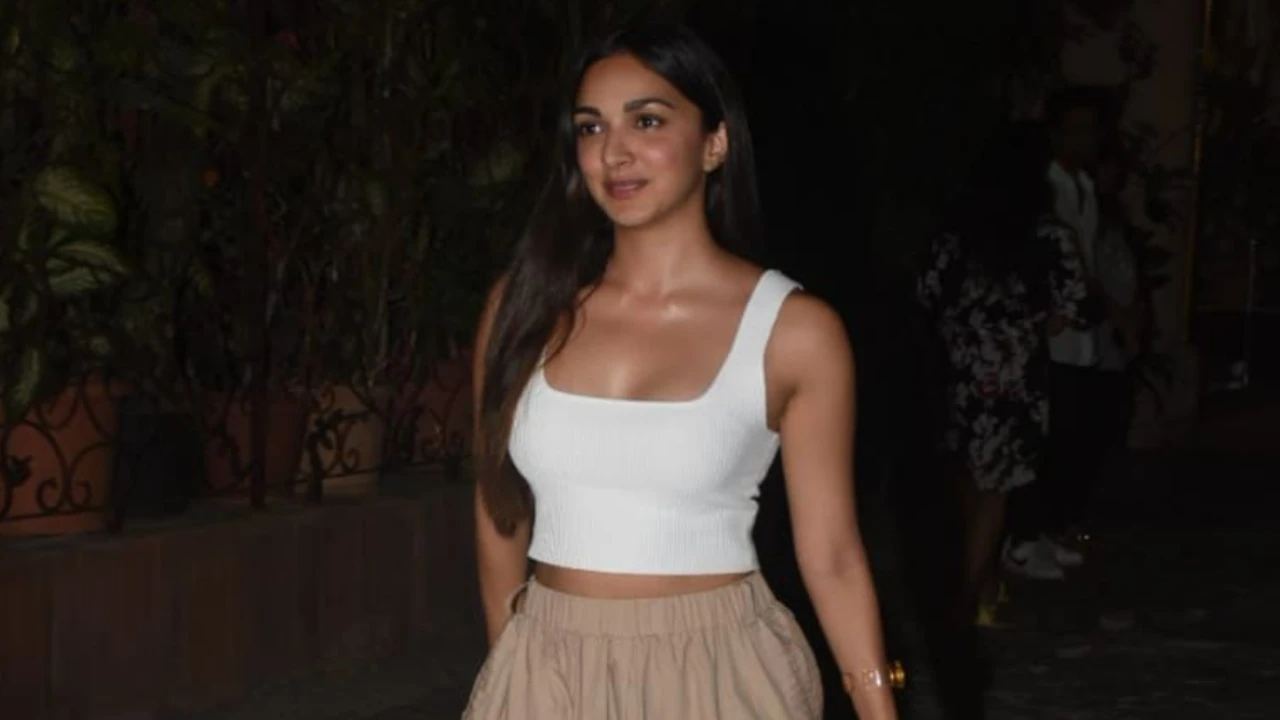 Kiara Advani wears a classy white and beige outfit with a cute neon handbag Kiara-advani-lv-neon-bollywood-doc-martens-summer-fashion