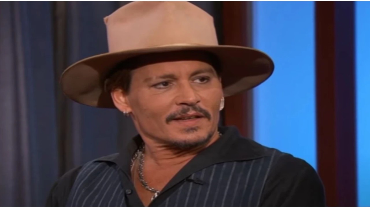 Johnny Depp flashes bright smile as he gets clicked with a cane ahead of Hollywood Vampires Boston concert