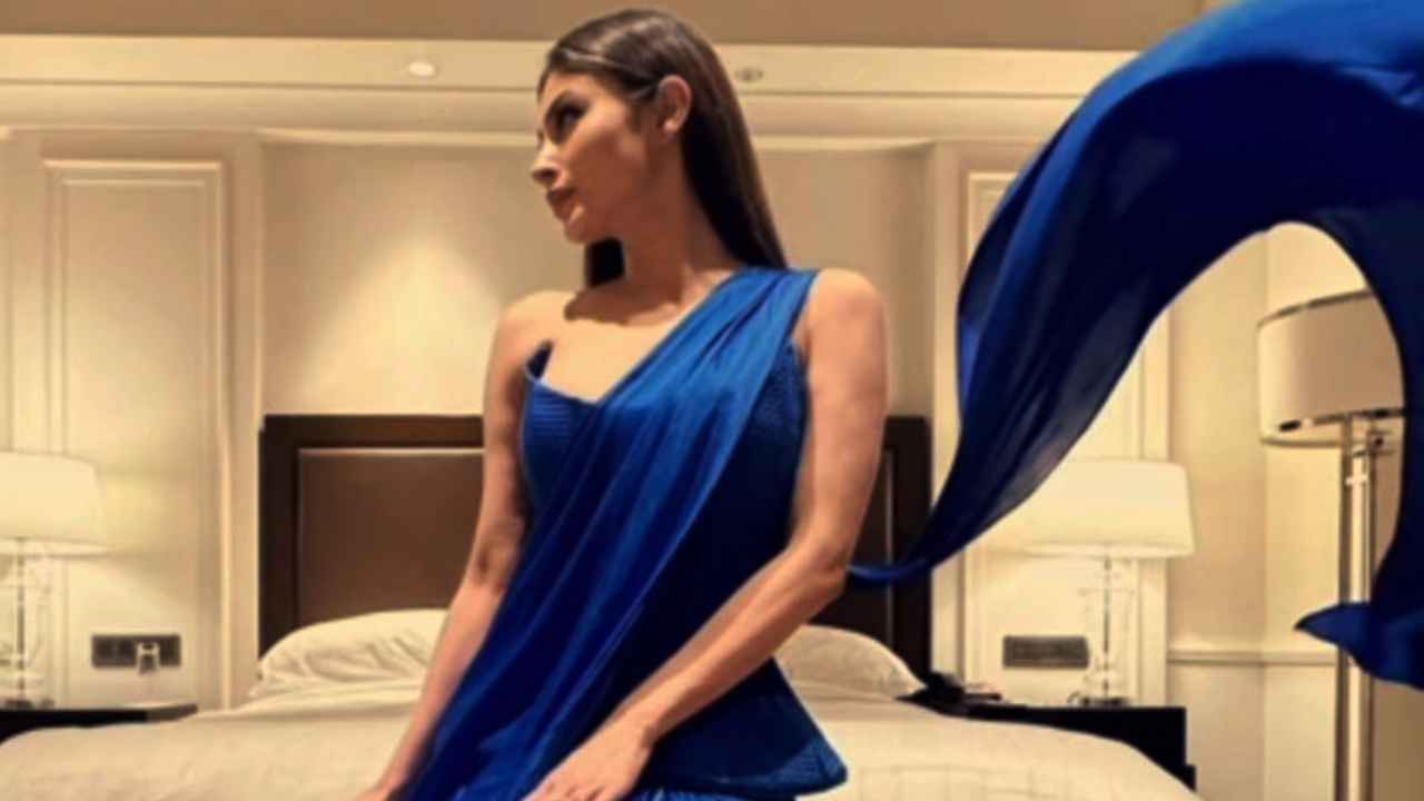 Mouni Roy’s electric blue Victorian corset with fusion drape saree is the ultimate choice for wedding season