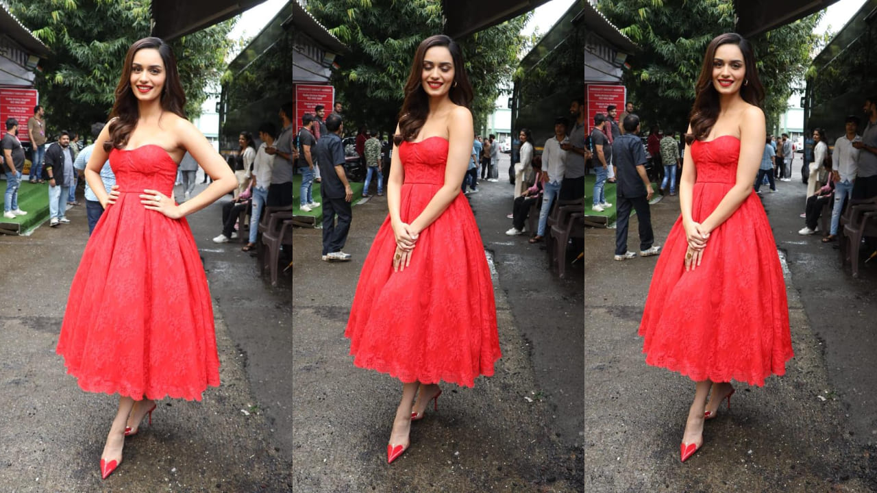 Manushi in a red lacy tea-length outfit