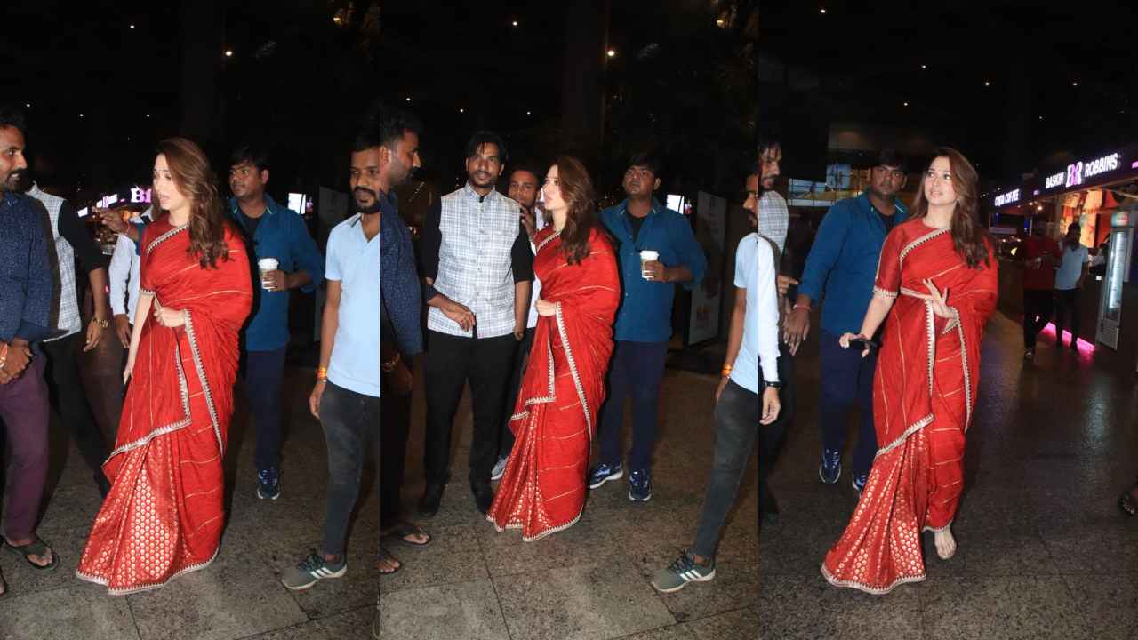 Tamannaah Bhatia was recently spotted and papped at the Mumbai airport, wearing a gorgeous red and gold saree (PC: Viral Bhayani)