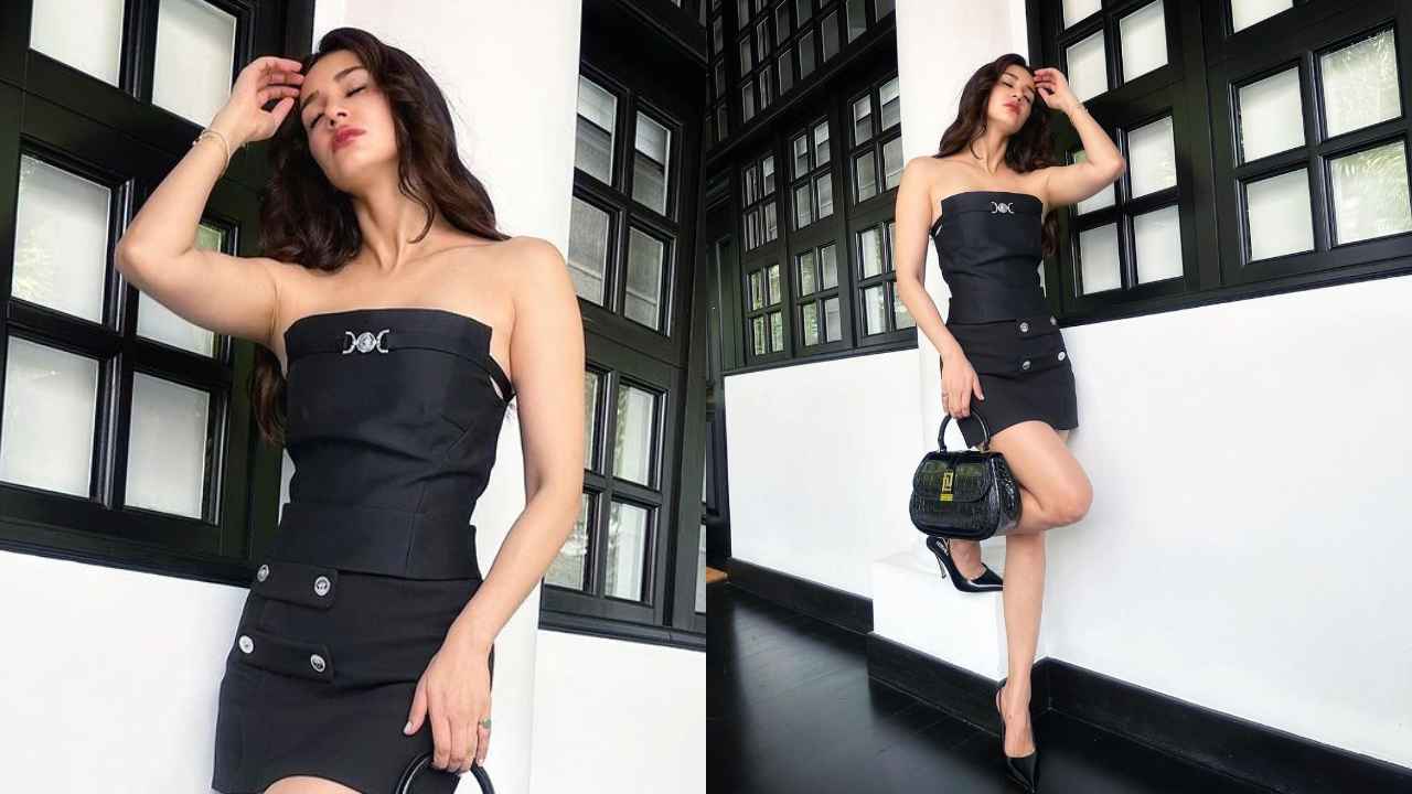 Disha Patani surpasses all levels of hotness in Versace’s little black dress with matching Rs. 3.9 lakh bag