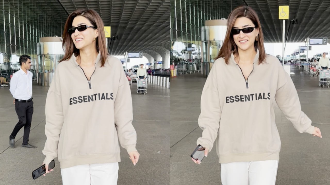 Kriti Sanon rocks the airport fashion in a khaki cardigan and white pants with Saint Laurent eyewear (PC: Manav Manglani)