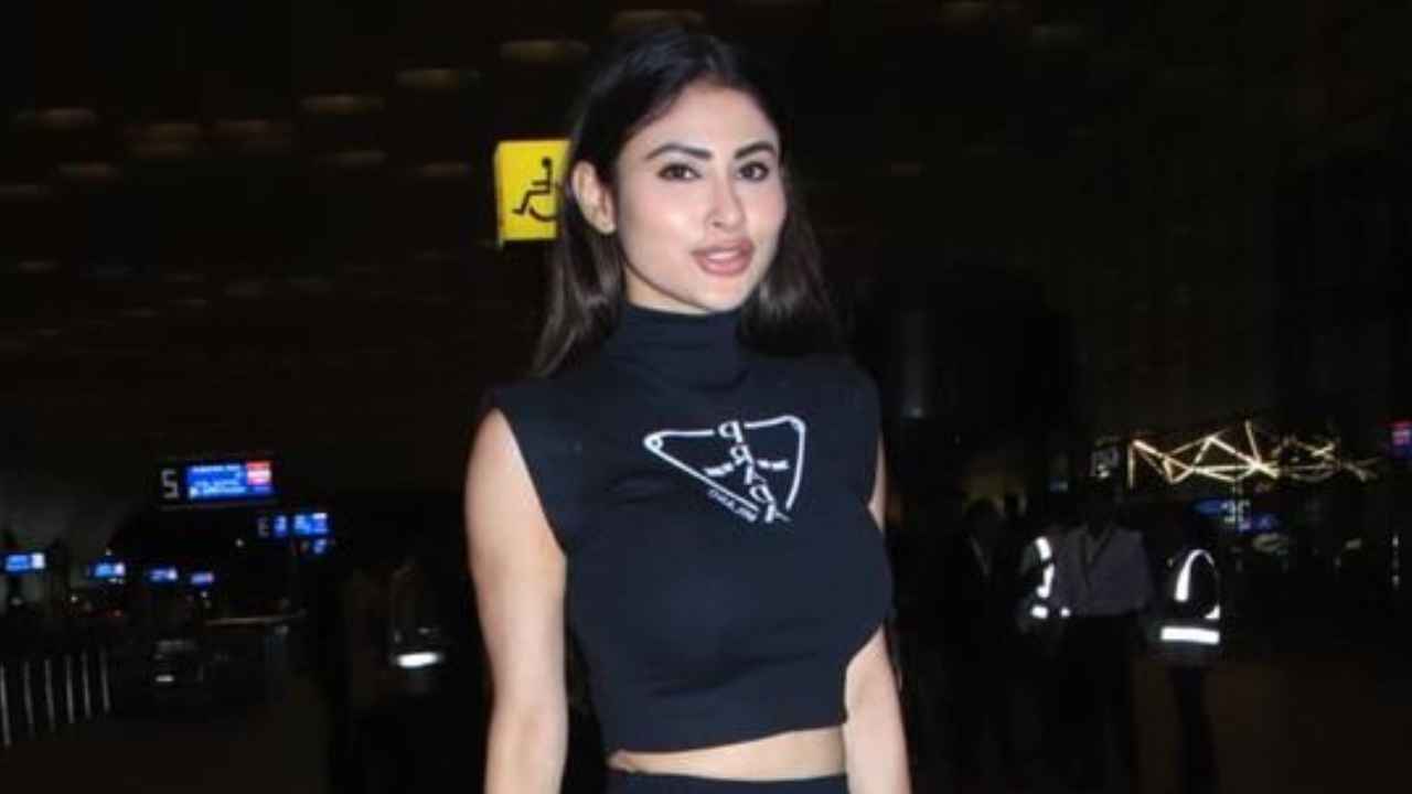 Airport Style: Mouni Roy merges comfort with style in all-black outfit with Prada Crop top and matching skirt (PC: Viral Bhayani)