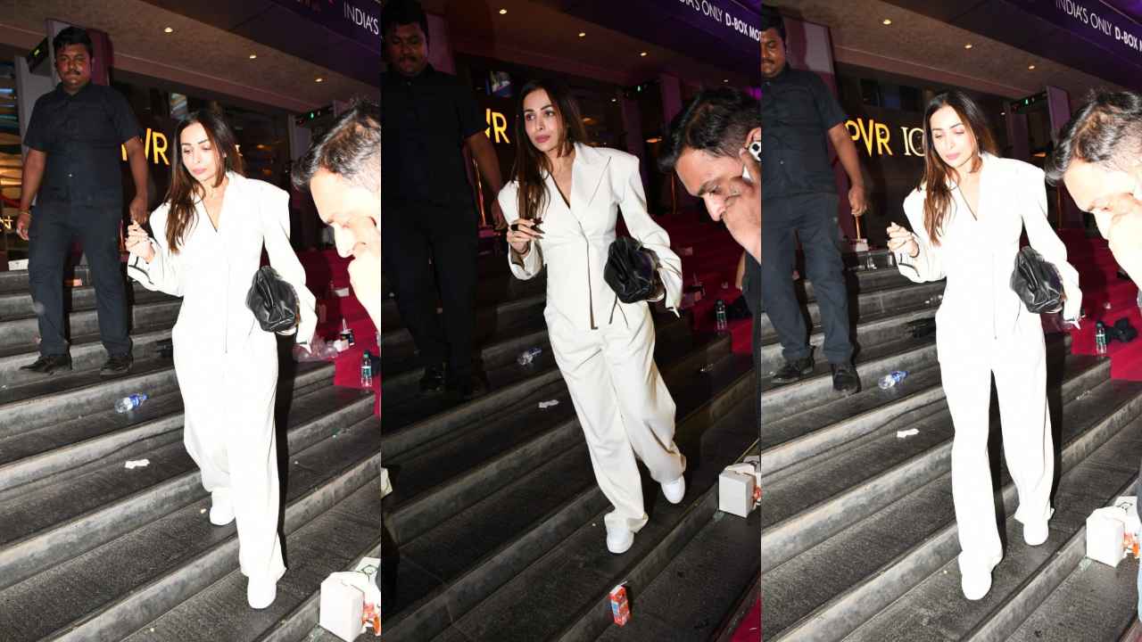 Malaika Arora SLAYS in white corset-like blazer with matching flared pants and an expensive Bottega Veneta bag (PC: Viral Bhayani)