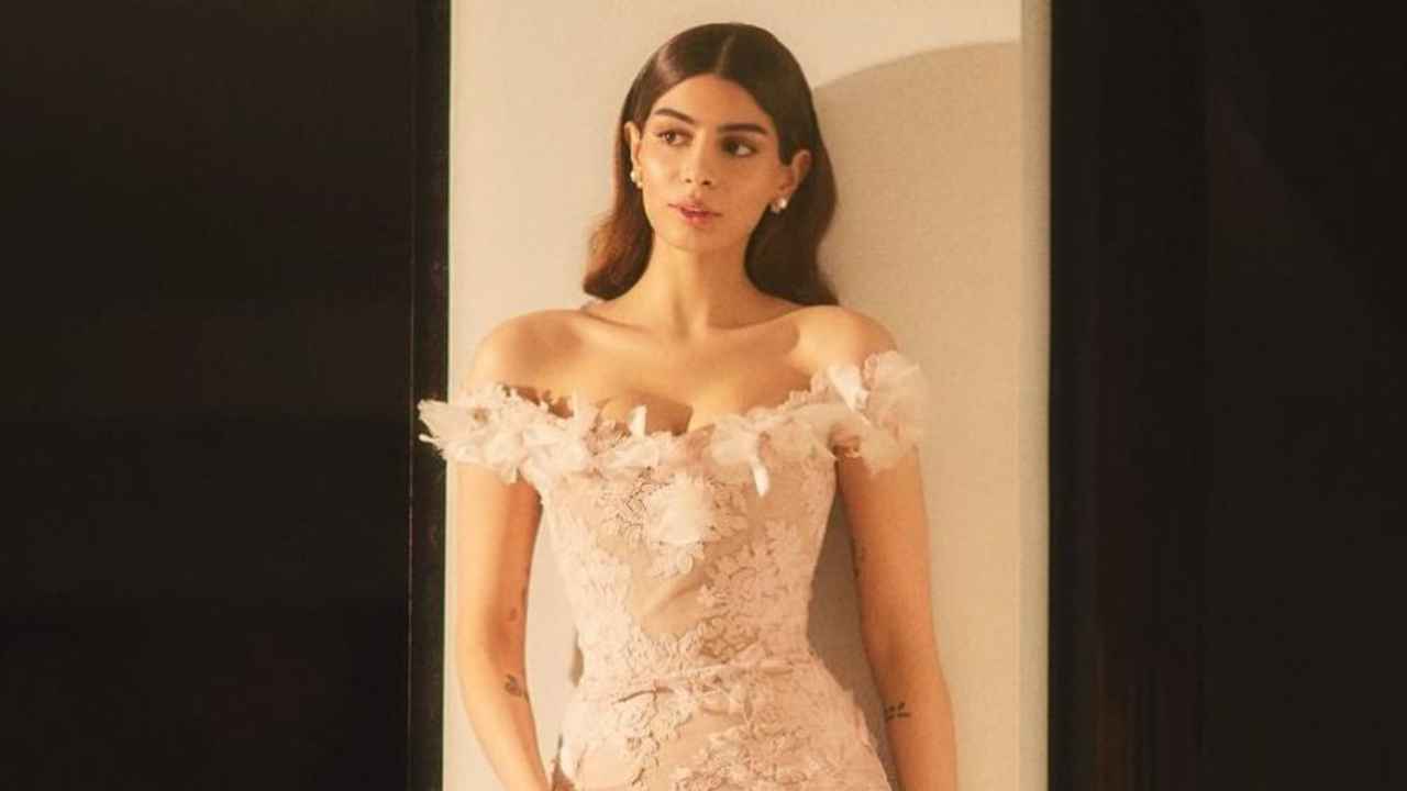 Khushi Kapoor’s pink Rs. 2,23,106 off-shoulder corded lace bodycon midi dress from Marchesa is a must-have