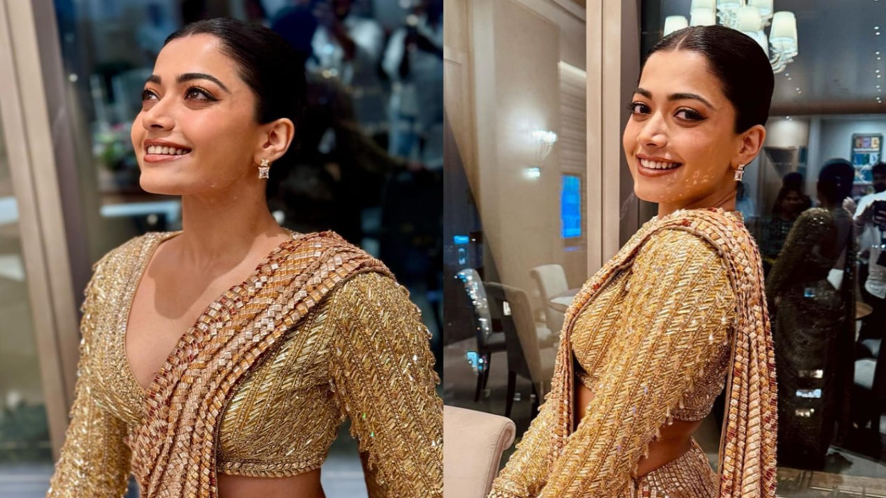 Rashmika Mandanna’s heavily embellished bustier with pre-draped modernized saree is all things GOLD. (PC: Vardan Nayak Instagram)