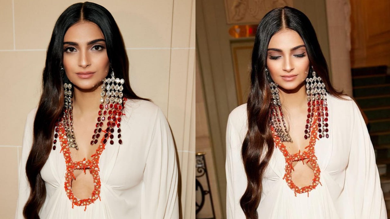 Sonam Kapoor adds drama to her Valentino white kaftan dress with dangling rhinestone chandelier earrings. (PC: Sonam Kapoor Instagram)