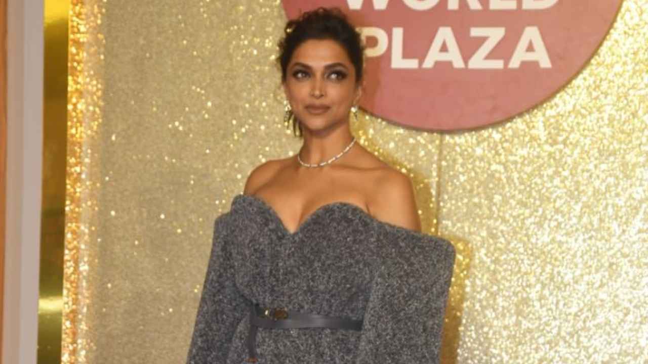 Deepika Padukone serves luxury in Louis Vuitton’s grey off-shoulder midi with Cartier’s statement accessories (PC: Viral Bhayani)