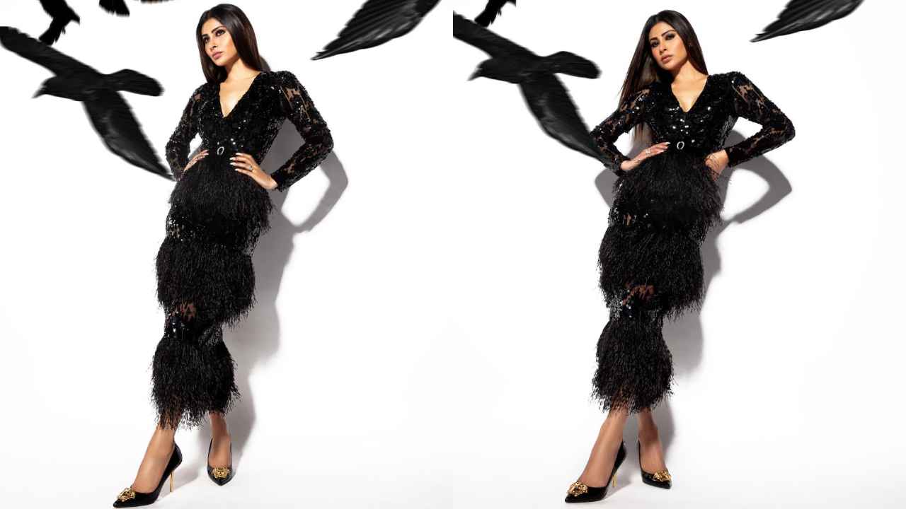 Mouni Roy’s black sequinned midi-dress with invisible tulle and ostrich feather trims is made for date nights (PC: Mouni Roy Instagram)