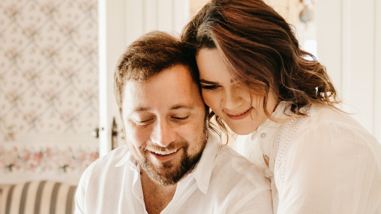 Happy Couple Looking at Pregnancy Test Together