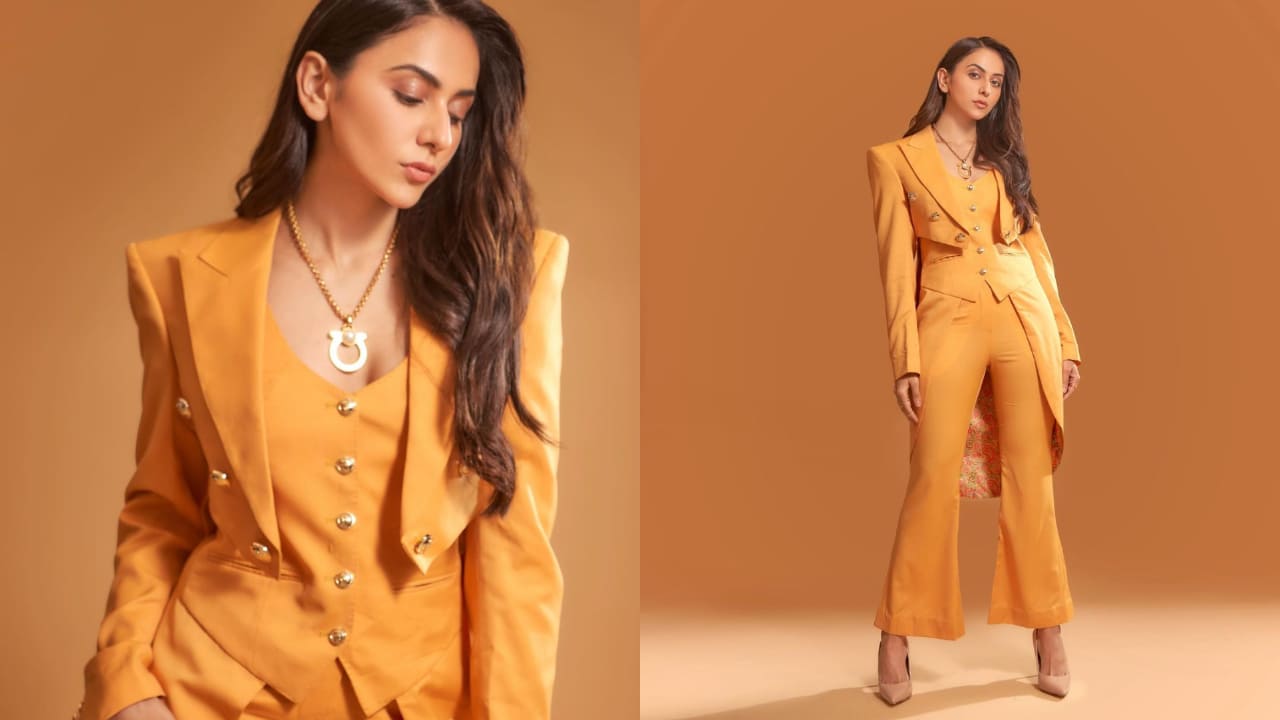 Rakul Preet Singh in mango orange colored blazer style