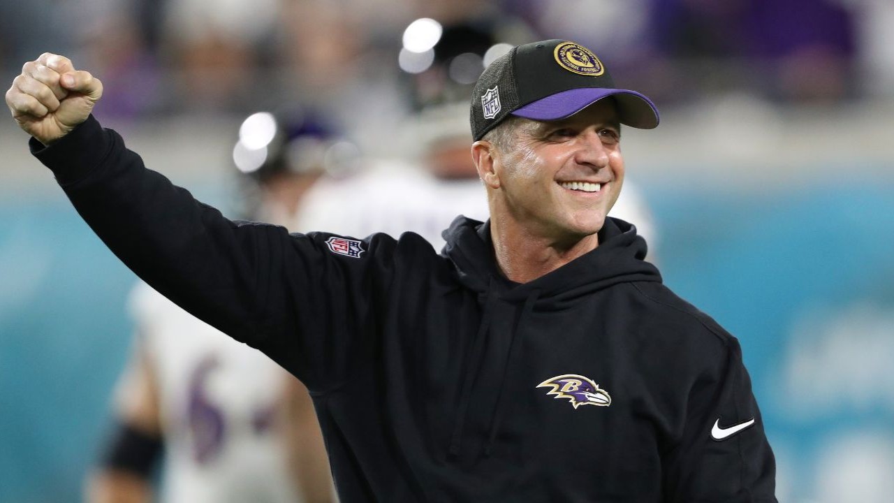 How much does John Harbaugh make in a year and where does he rank among highest-paid coaches in U.S. sports?