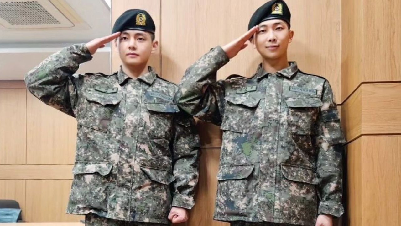 BTS' V sings along to Army song at military graduation after being awarded elite trainee status alongside RM