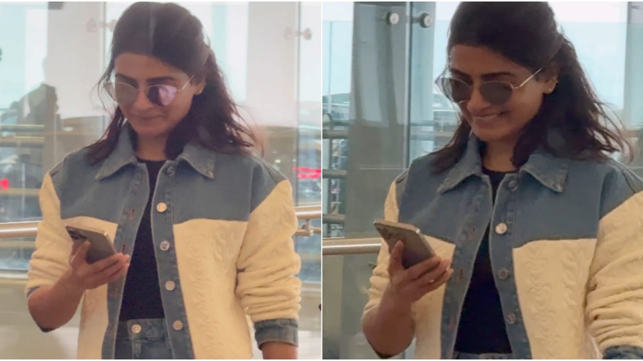 What is making Samantha blush as she looks into her phone?