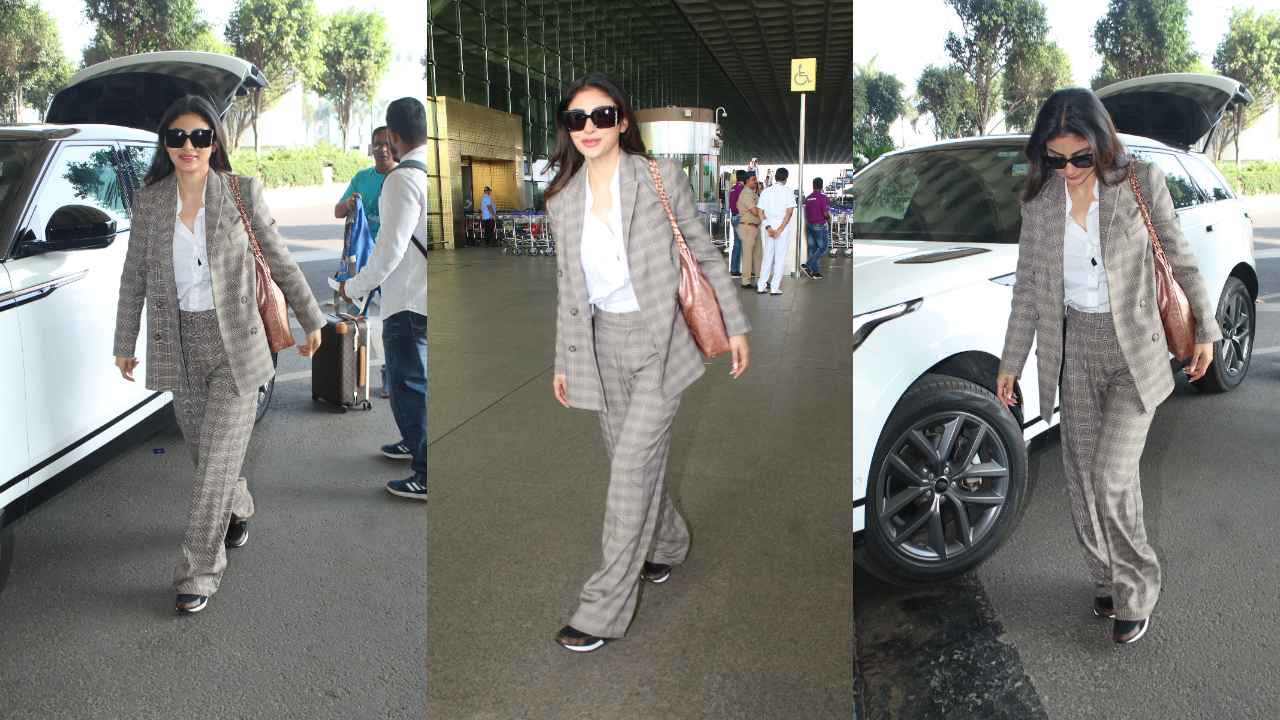 Mouni Roy makes a case for power dressing with her airport look in grey pantsuit and Rs 5.77 lacs Chanel bag (PC: Viral Bhayani)