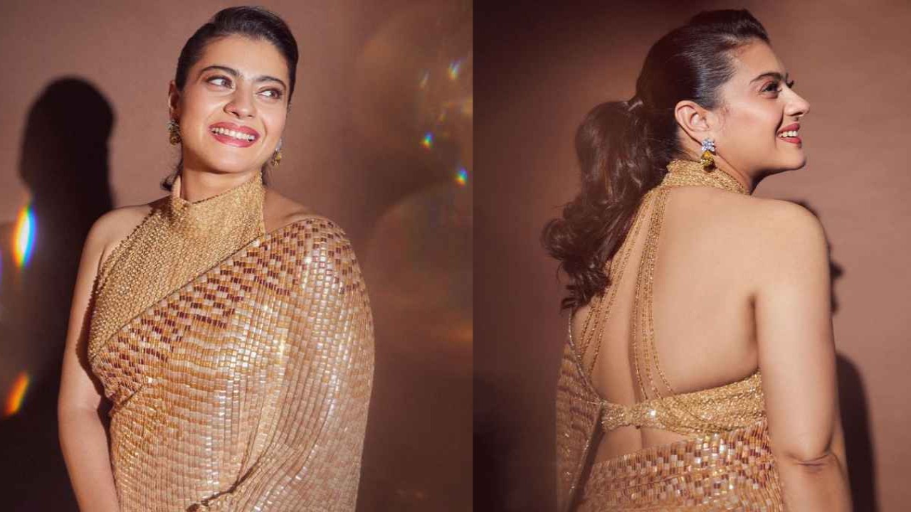 Kajol looks like an irresistible firecracker in a pretty gold Manish Malhotra drape with halter-neck blouse