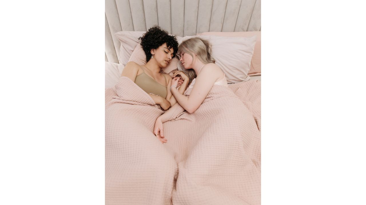 A Couple Sleeping in the cliffhanger sleeping Position And What it Means