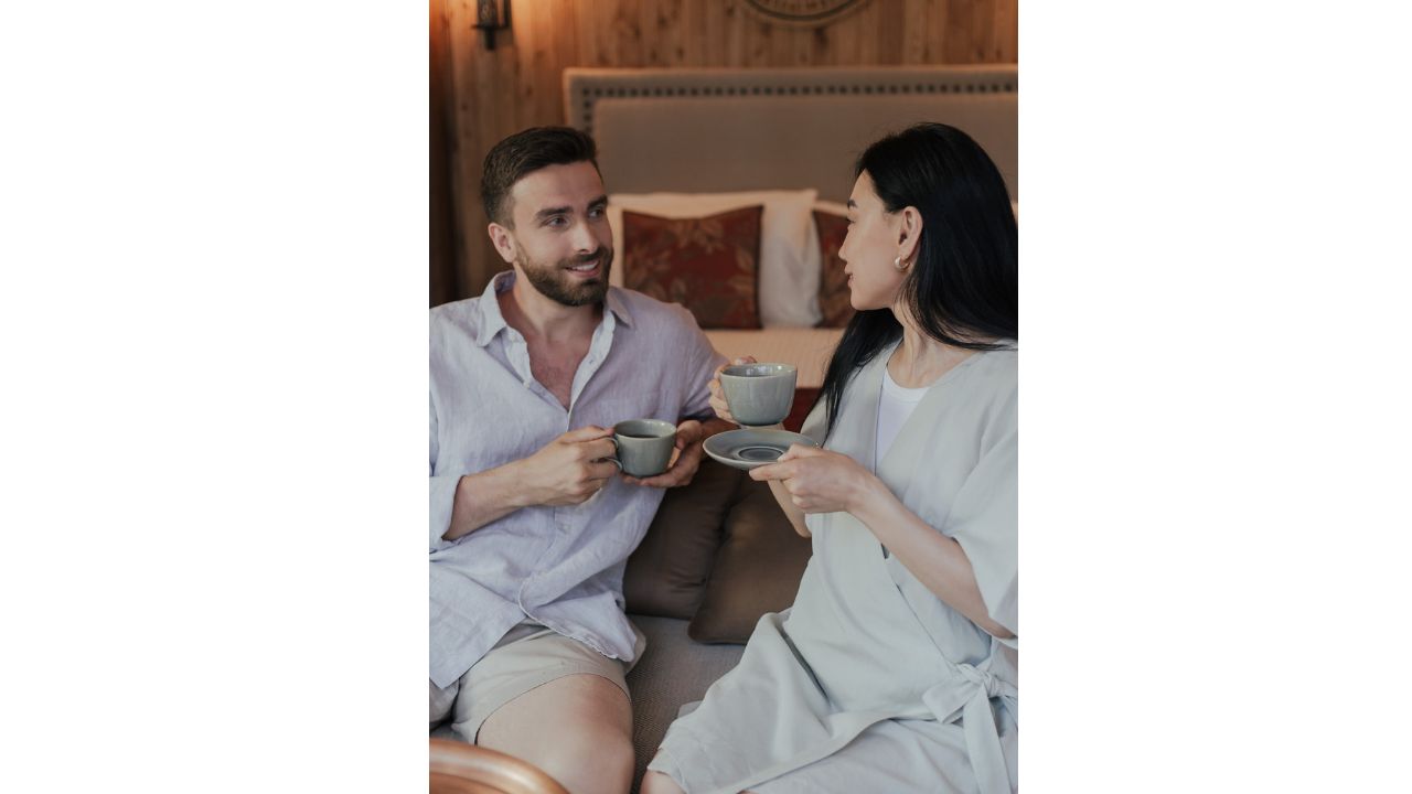 Man and Woman Holding Cups