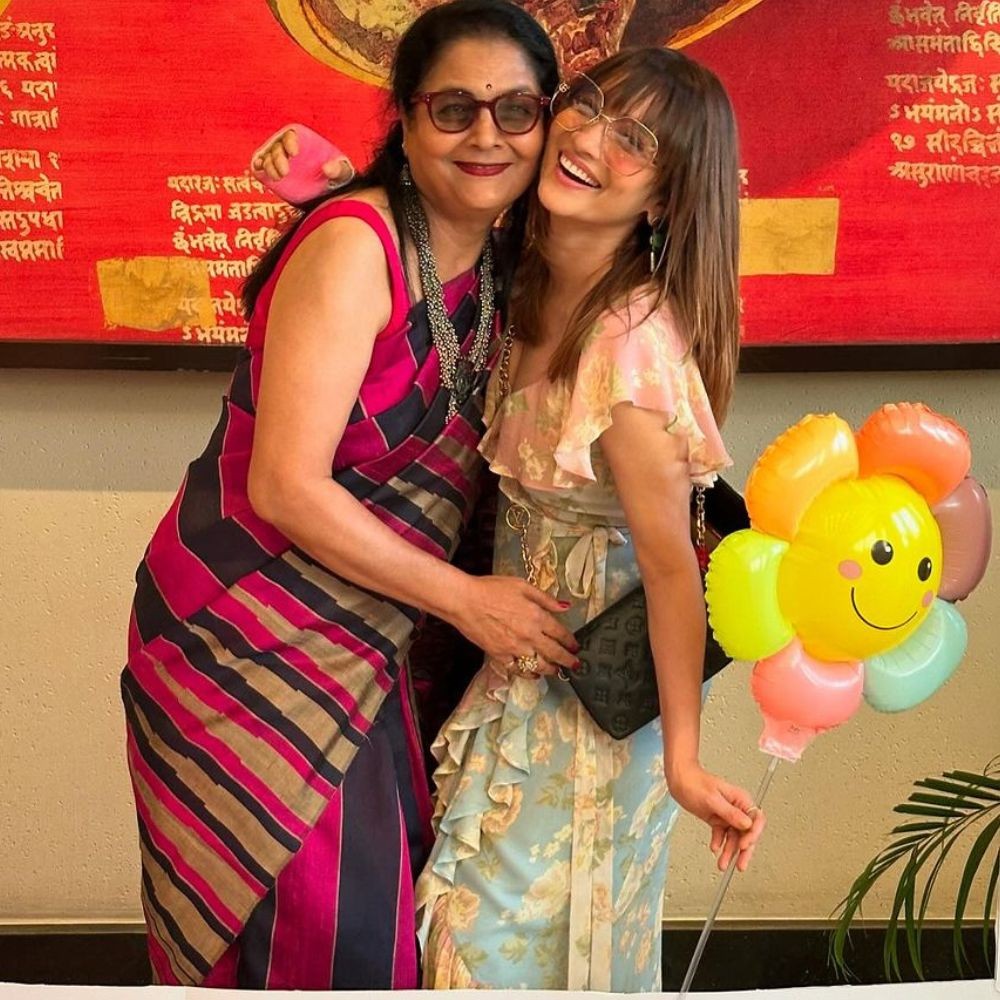 Ankita Lokhande cutely holds her mother's hand as they arrive in style at Mumbai airpor...