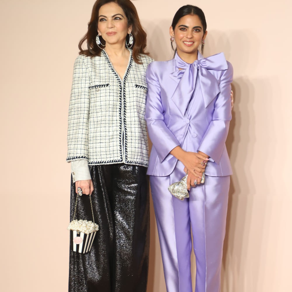 Isha Ambani in a Giorgio Armani lavender pantsuit with an OTT bow proves that power suits are best served with side of glam Isha Ambani in a Giorgio Armani lavender pantsuit with an OTT bow proves that power suits are best served with side of glam