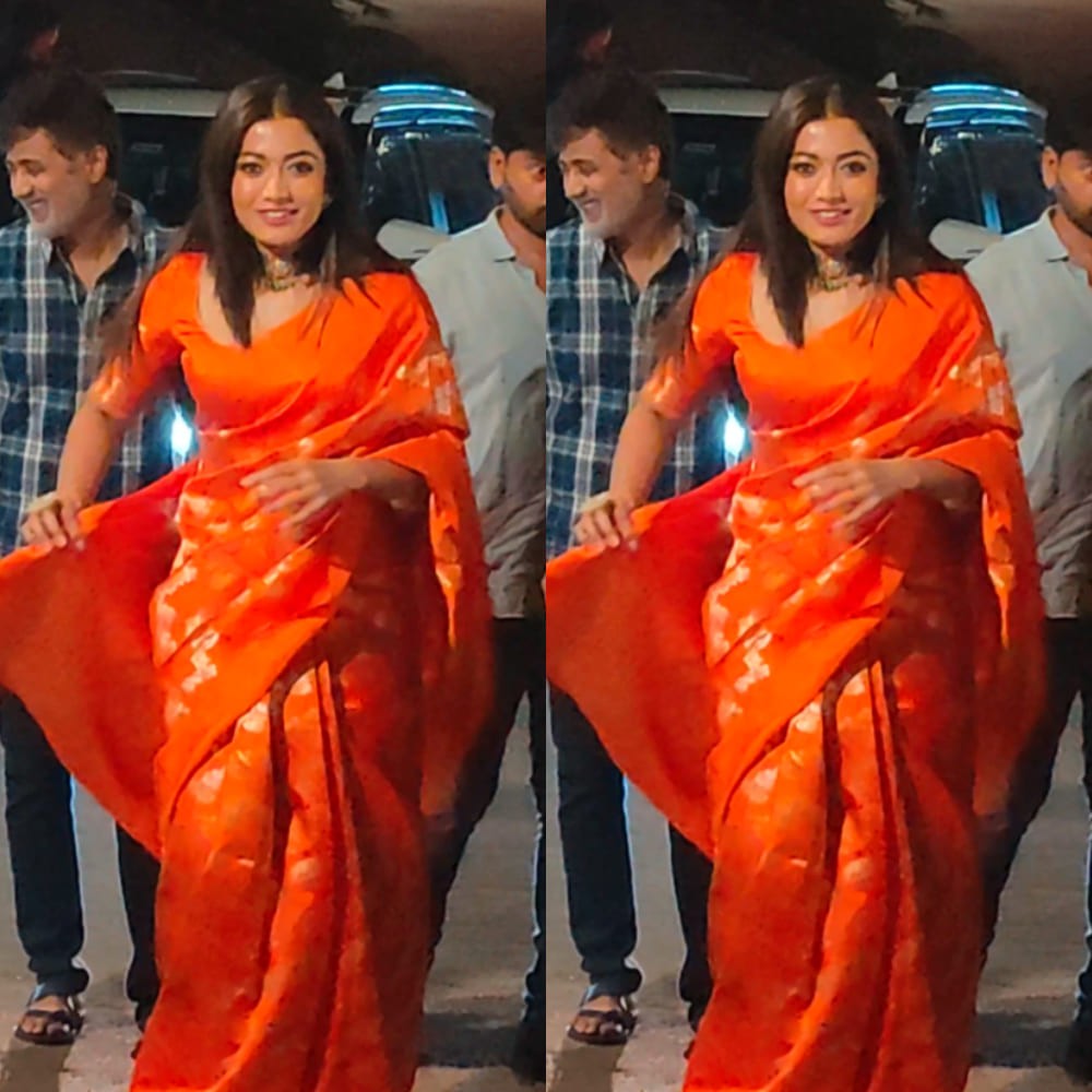 Rashmika Mandanna looks no less than a fire in her bright orange silk saree and layered...