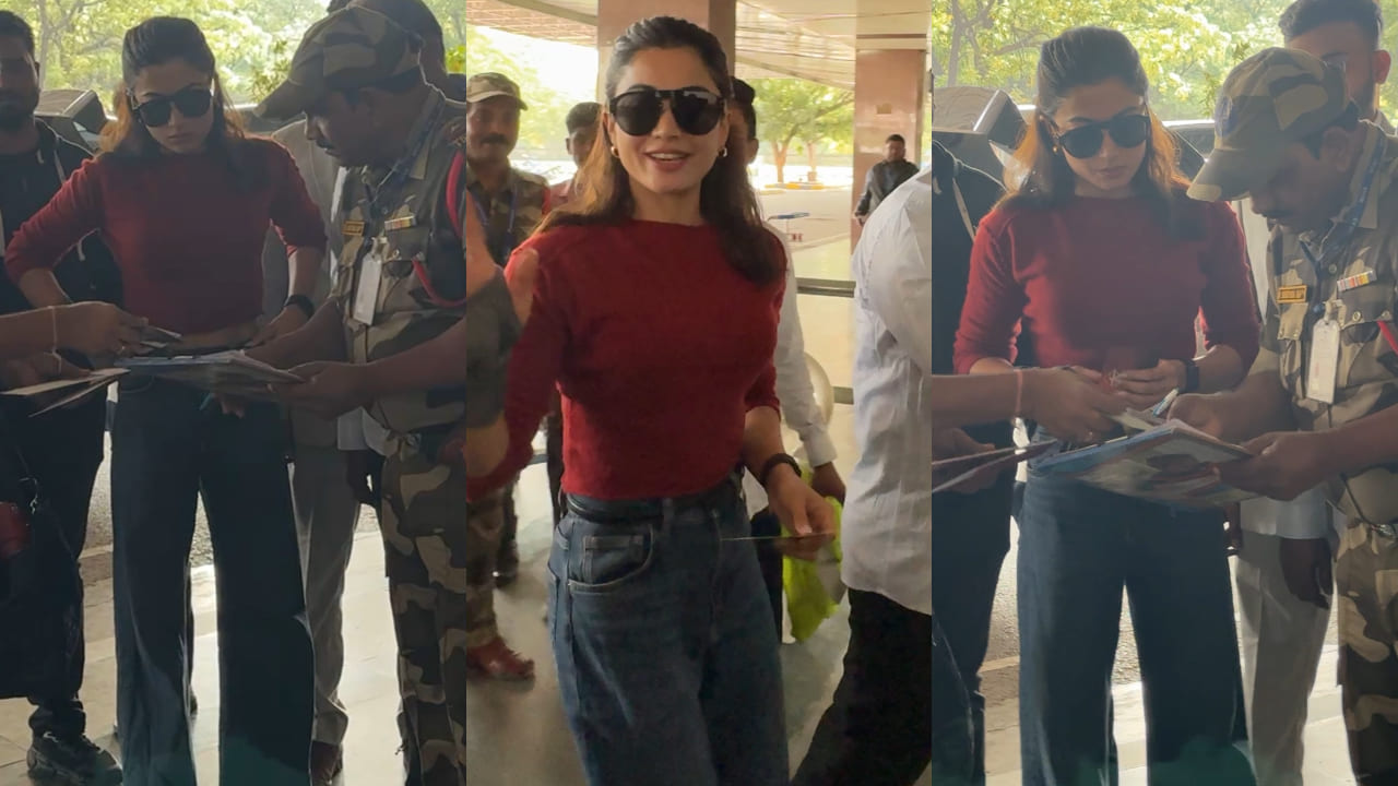 Rashmika Mandanna in maroon top and jeans 