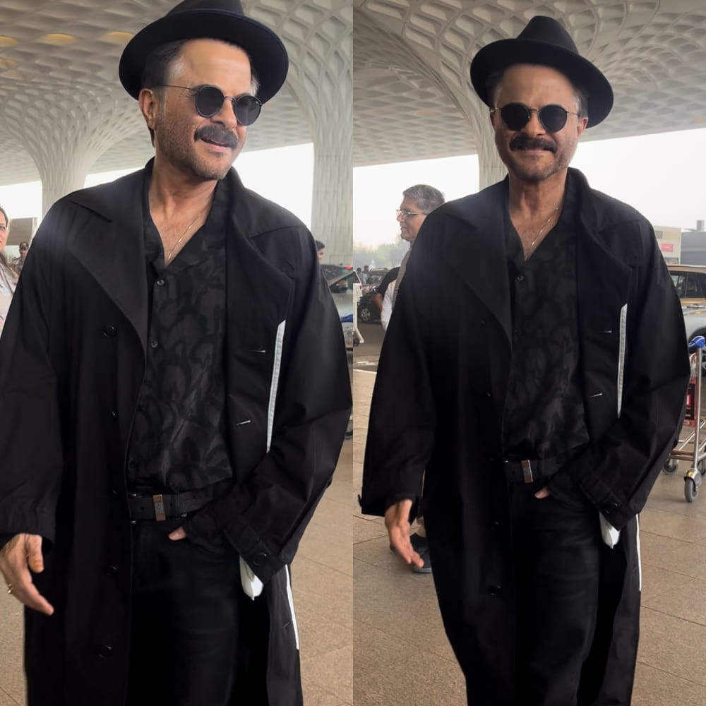 Anil Kapoor looks suave and stylish at the airport in an all-black outfit ft. shirt and long coat  Anil Kapoor looks suave and stylish at the airport in an all-black outfit ft. shirt and long coat